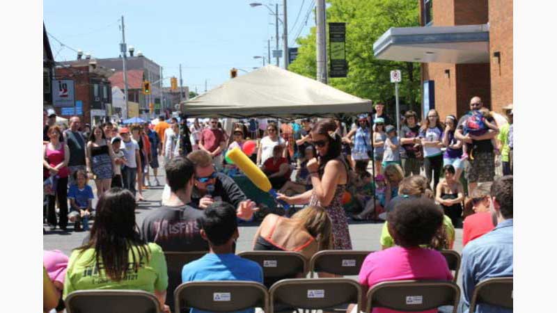 Hypnotist Cambridge, Brunette girl with a nerf bat gently hit a blonde girl putting her to sleep Mike is close by ensuring the sleeping blonde girl doesn't fall out of her chair. Taken in Cambridge Ontario